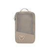 A beige stroller hanging diaper bag with a mesh front and a small bear patch on the bottom.