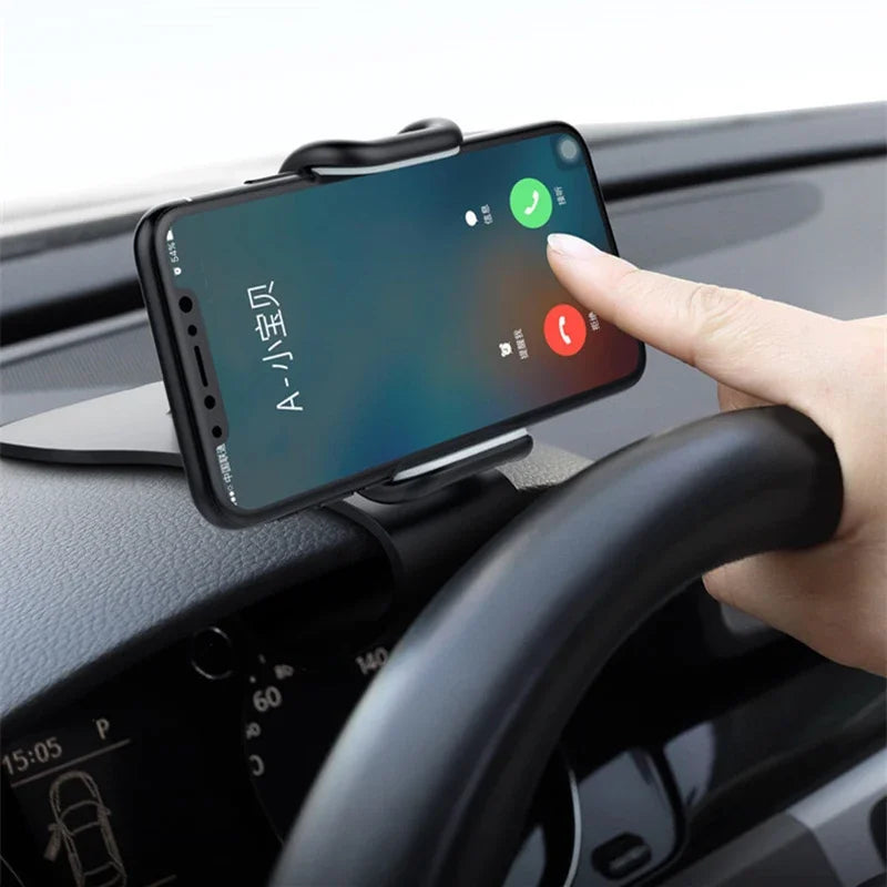 A hand places a smartphone onto a black car interior mount for hands-free viewing.