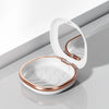 A white compact orthodontic retainer case with a hinged lid and built-in mirror, shown in a studio setting.