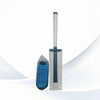 A disposable toilet cleaning brush with a gray handle and blue bristles, shown next to its storage base.