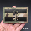 A black and white striped tactical patch featuring a national flag design with hook-and-loop backing.