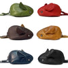 Four genuine leather cartoon mouse coin purses in green, red, brown, and black.