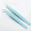 A pair of light blue macaron color craft tweezers for scrapbooking and journaling