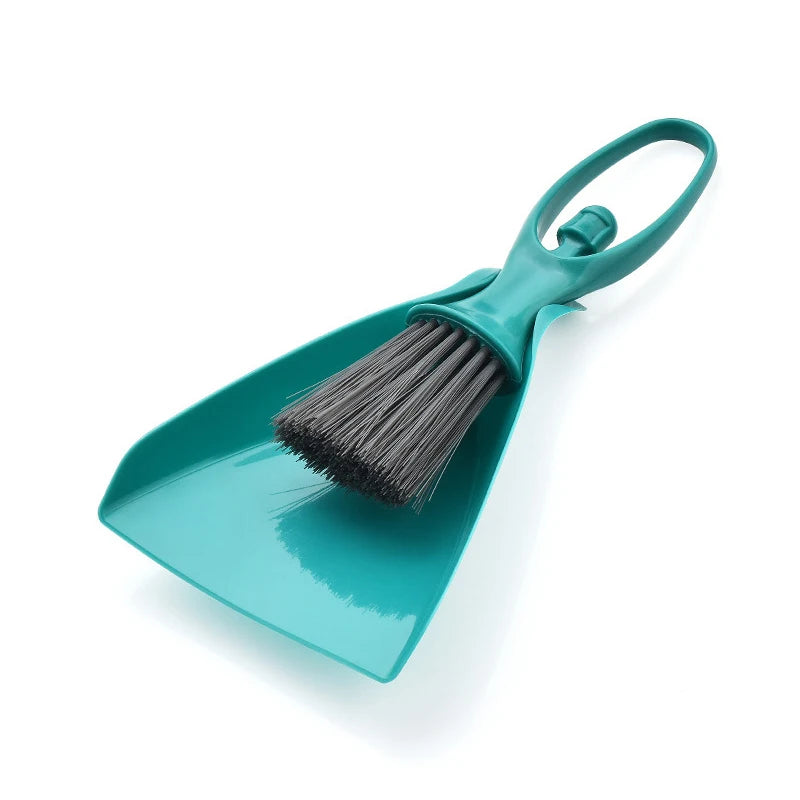 A teal compact mini broom and dustpan set with a handle and bristles for cleaning desks and keyboards.