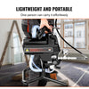 A person is easily carrying a black high-efficiency airless paint sprayer with a hose and pump.