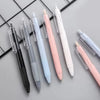A pack of five retractable gel pens in various colors including black, silver, light blue, pink, and white, arranged diagonal