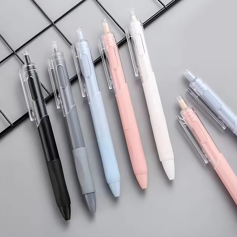 A pack of five retractable gel pens in various colors including black, silver, light blue, pink, and white, arranged diagonal