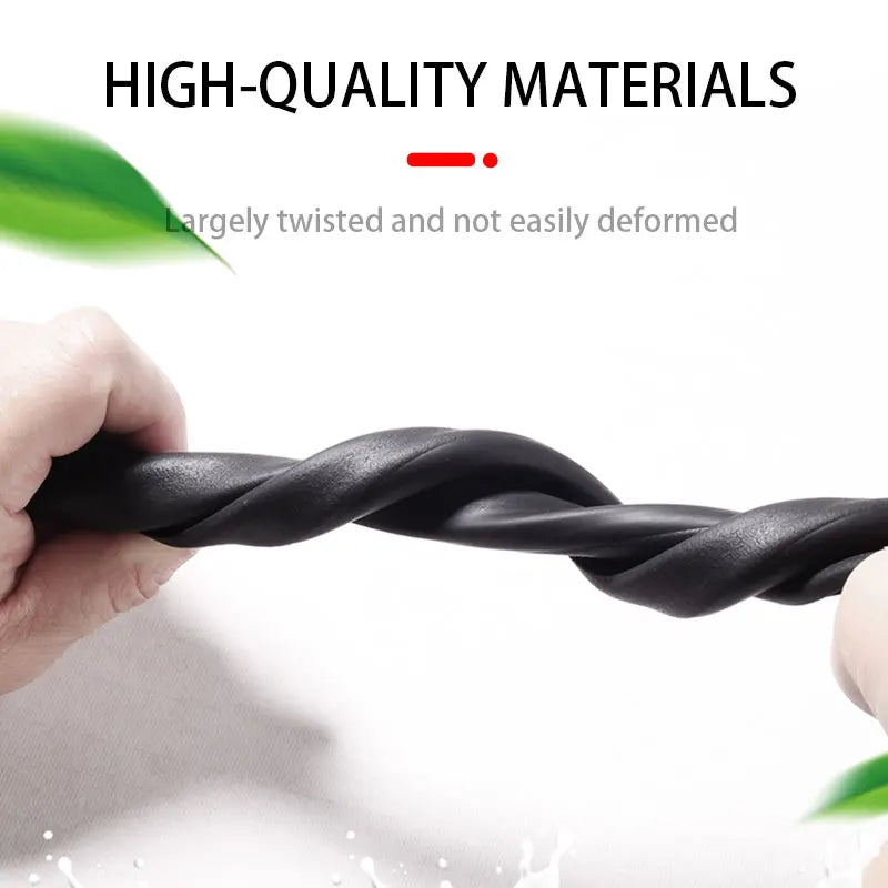 A hand is twisting a black, flexible door edge protector strip to demonstrate its twisted and durable quality.