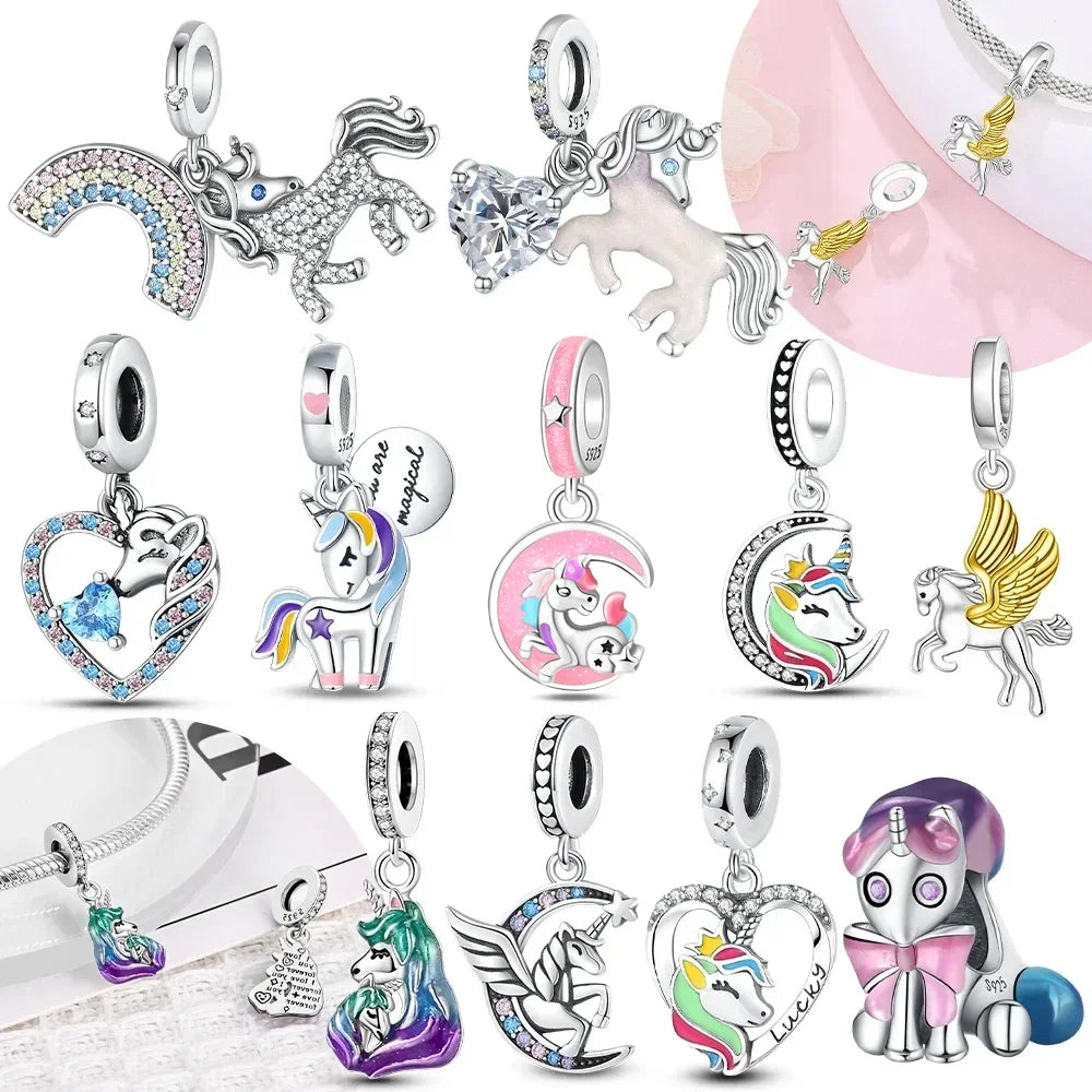 A collection of unicorn and pegasus charms featuring various colors and sparkling crystals.