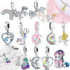 A collection of unicorn and pegasus charms featuring various colors, sparkles, and silver metal.