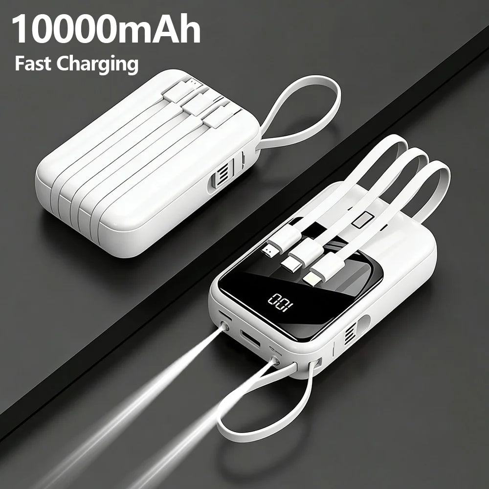 A white 10000mAh portable power bank with built-in cables and a flashlight is shown lying on a dark surface.
