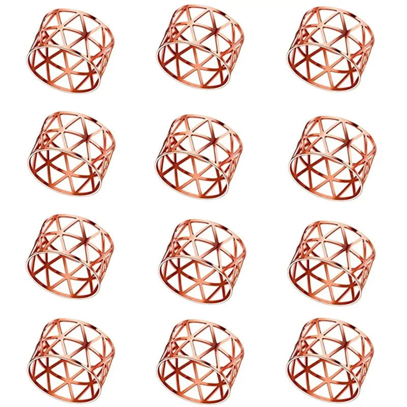 A set of twelve decorative metal napkin rings featuring a geometric hollow-out pattern in rose gold finish.