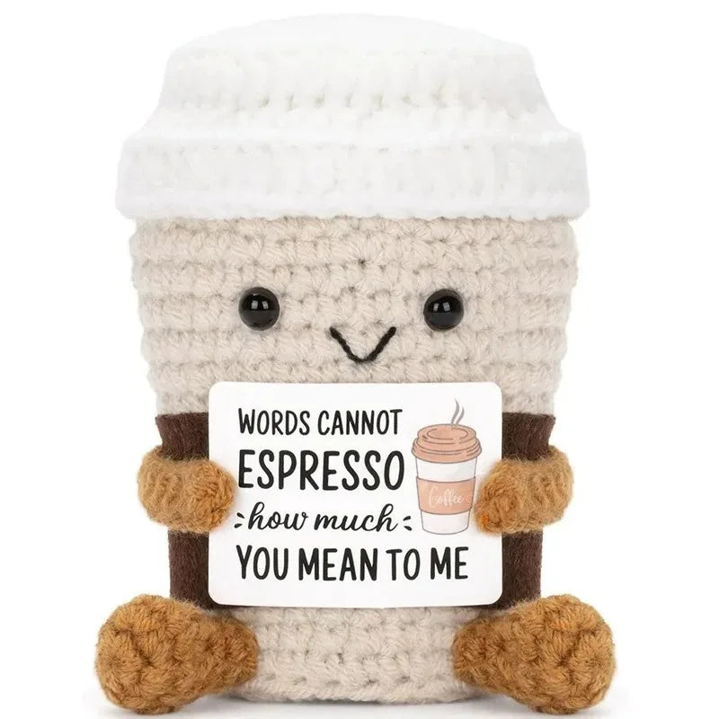 A handmade crochet pocket hug doll with a light beige body and white knitted cap.
