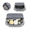 A gray waterproof diaper bag with a clear pocket showing insulation and various supplies inside.