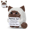 A handcrafted crochet cat figurine with an inspirational card that reads Positive Cat I may be a tiny cat but I believe in yo