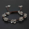 A set of braided crystal chip stone bracelets made with natural amethyst quartz and gemetone weave.