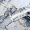 Marble peel-and-stick wallpaper featuring gray marble texture with gold leaf accents.