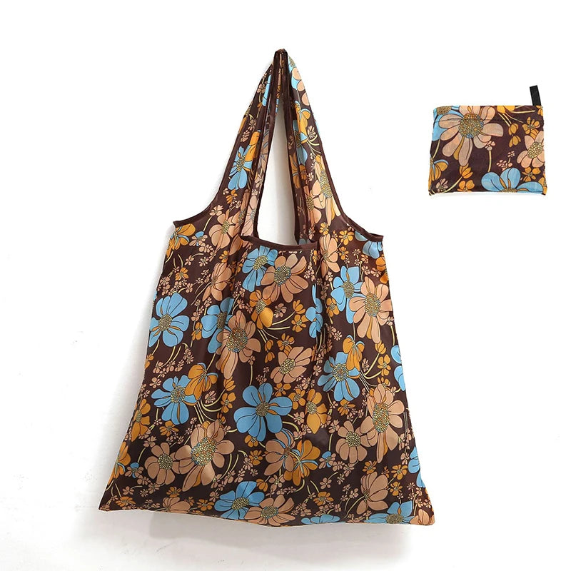 A brown floral patterned reusable shopping tote bag with a matching fabric carry pouch.