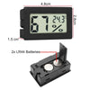 A black mini digital thermometer and hygrometer with an LCD display showing 67 degrees and 24.3 percent humidity.