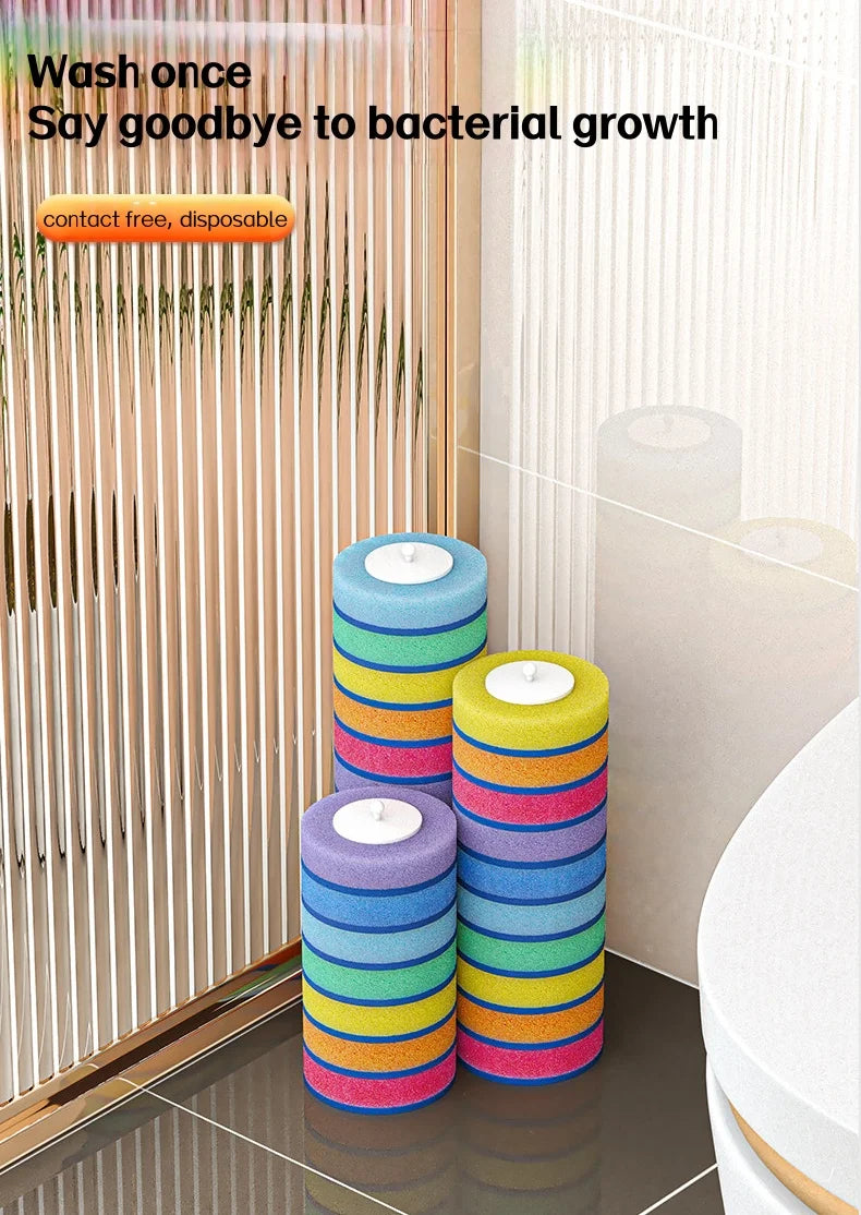 A set of colorful, disposable toilet brush heads stacked in a holder next to a wall-mounted dispenser.