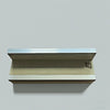 A wooden portable fingerboard ramp set featuring a quarter pipe and rail mounted on a light gray wall.