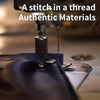 Close-up of a sewing machine stitching a thread in authentic materials.