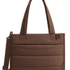 A brown quilted boxy tote bag with a long handle is shown against a white background.