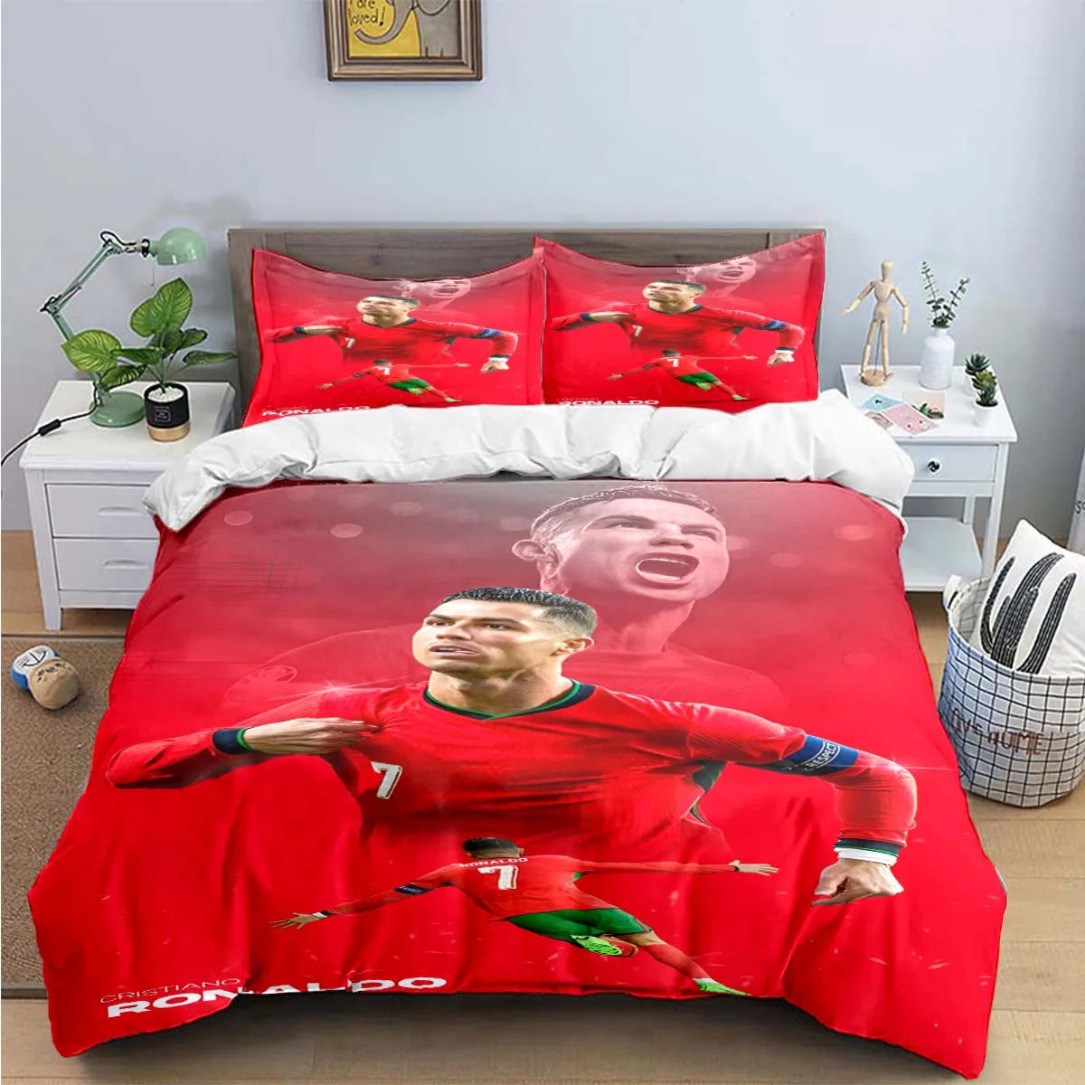 A red soccer player graphic duvet cover featuring Cristiano Ronaldo on a bed.