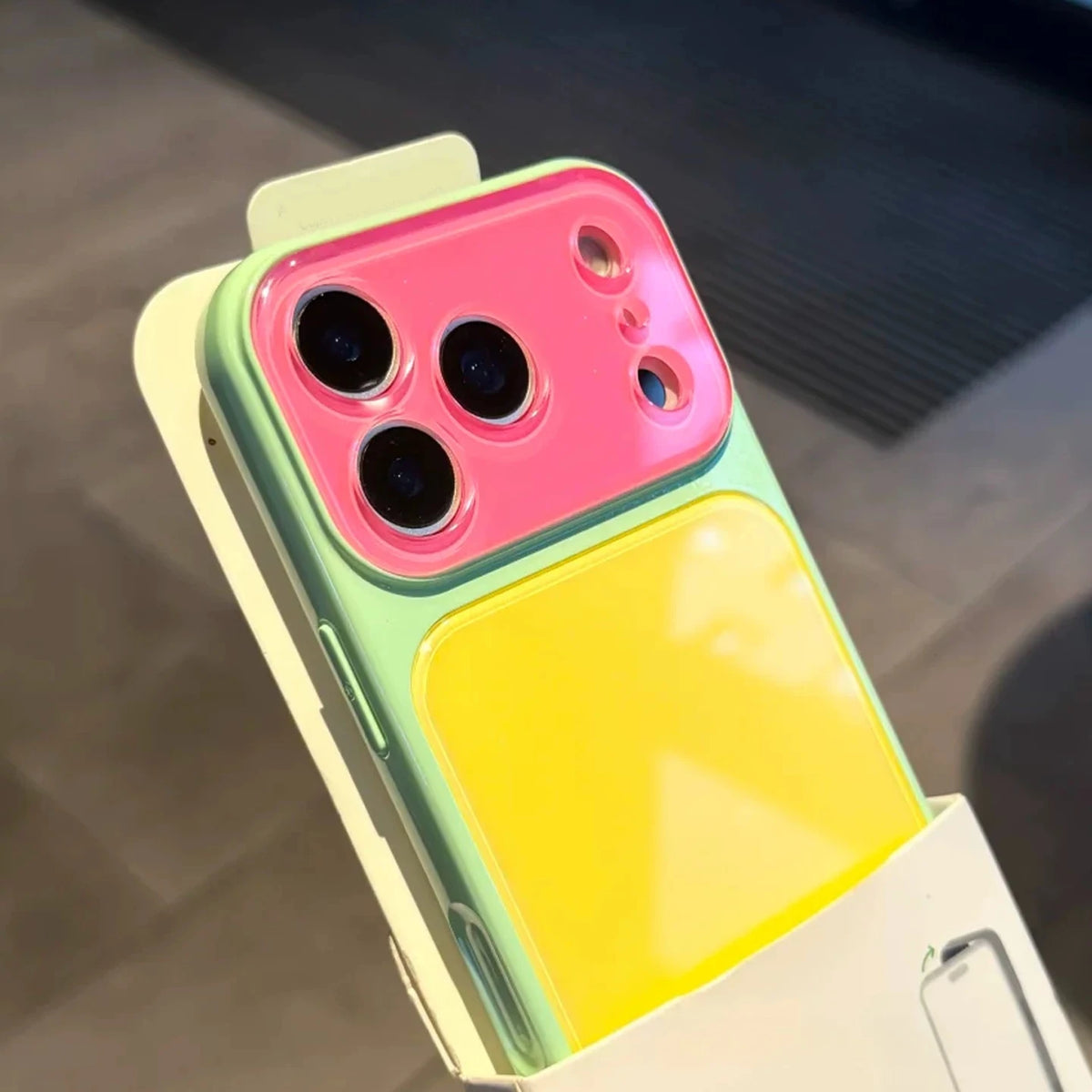 Color blocking shockproof phone case featuring a pink and yellow design with multiple camera windows.