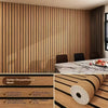 Brown plaid peel and stick wallpaper with a faux finish applied to a wall.