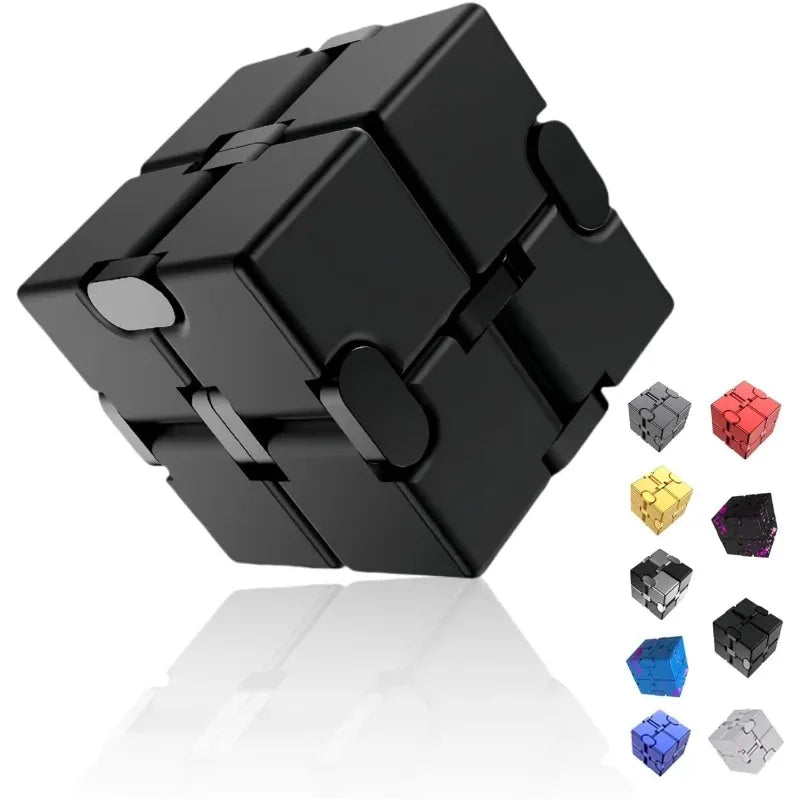 A black metal infinity fidget cube with various colored cube pieces displayed on a reflective surface.