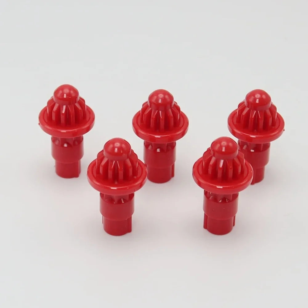 A set of five red replacement drivers for a battling top, featuring a dome-shaped knob and a cylindrical base.