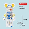 Astronaut building block set featuring a bear figure with yellow accents and white body parts.