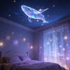 A bedroom scene featuring a ceiling projector displaying an illuminated whale, butterfly, and star pattern onto a window.