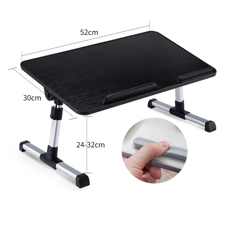 Black adjustable foldable laptop desk with a smooth surface and silver legs.