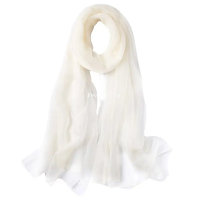 A sheer white silk scarf draped elegantly