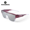 A pair of purple-tinted Rockbros sunglasses with a pink frame and clear lenses.