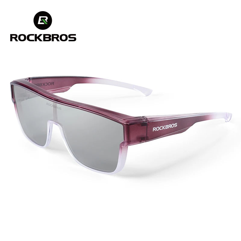 A pair of purple-tinted Rockbros sunglasses with a pink frame and clear lenses.