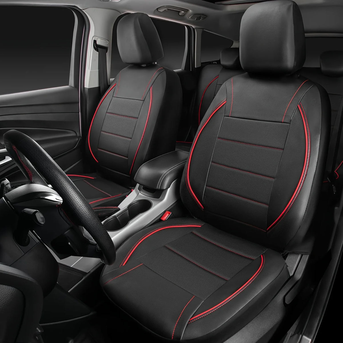A full set of black leather car seat covers with red stitching installed in a vehicle interior.