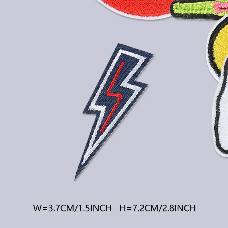 A dark blue lightning bolt embroidered patch with red detailing on a light gray background.