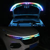 Close-up of an RGB LED light strip installed on a car hood, showing colorful illumination.