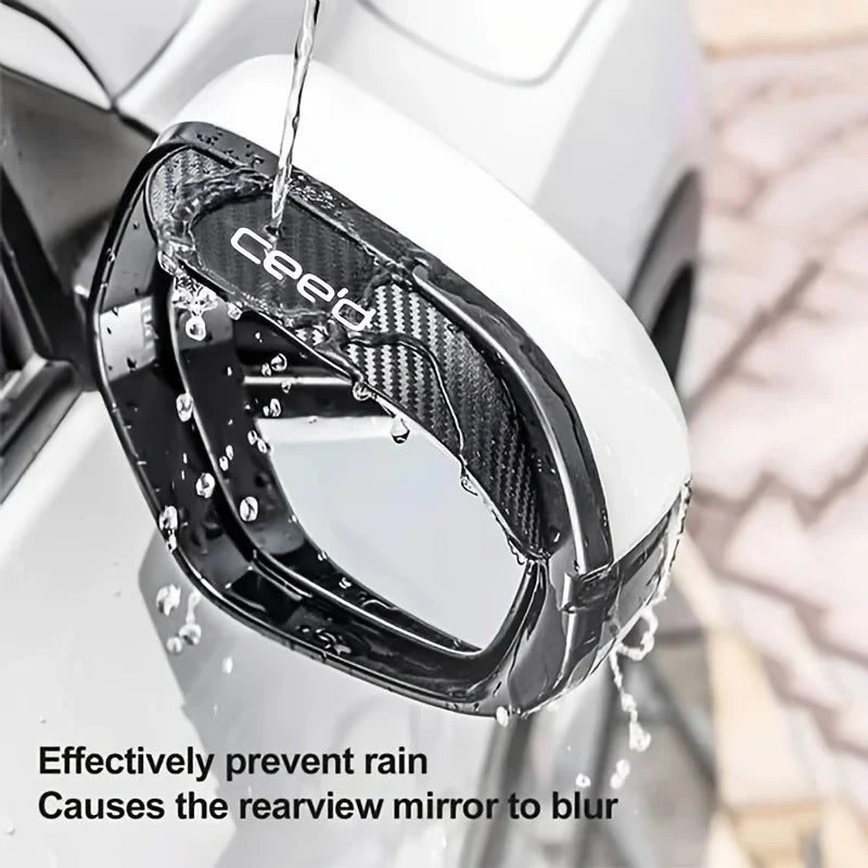 Carbon fiber rain guard protecting a car's rearview mirror from rain and blurring.