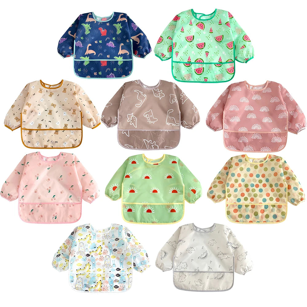 A collection of colorful waterproof long-sleeve baby bibs featuring various patterns and designs.