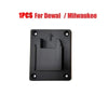 A single black wall-mount battery holder for Dewalt or Milwaukee 18V power tools.