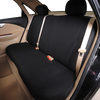 Interior view of a car with a black universal rear bench seat cover installed.