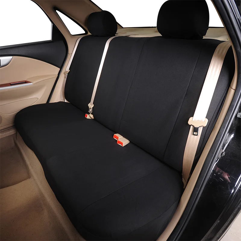 Interior view of a car with a black universal rear bench seat cover installed.