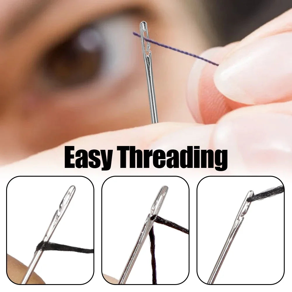 Close-up of a stainless steel self-threading sewing needle being used for hand sewing.