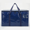 A dark blue heavy duty waterproof moving bag with handles and zippers.