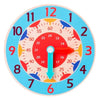 A wooden clock face with numbers and colored markers, showing the time, used as a Montessori educational toy.