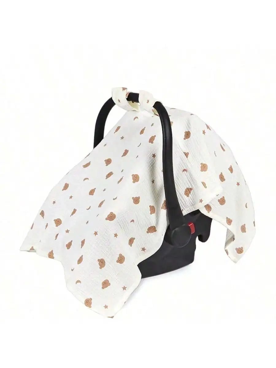 A white breathable stroller cover with a subtle pattern of small brown stars and black straps.